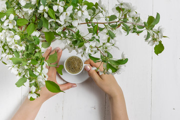 Romantic coffee in the blossoming garden, spring breakfast