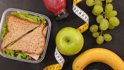 healthy lunch or breakfast with sandwich, juice and fruit