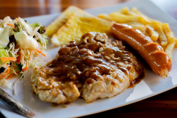 grilled pork steak with french fries