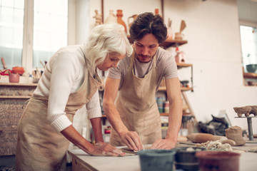 Nice pleasant woman and man working together