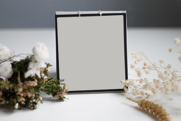 on a gray background box for recording with flowers and objects close-up