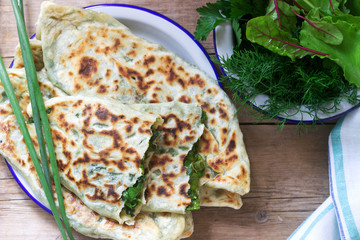 Baker making traditional dish of Armenians from Artsakh Zhingyalov hats is a type of flatbread stuffed with herbs.