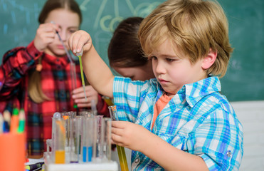 Child care and development. School classes. Kids adorable friends having fun in school. School chemistry lab concept. Experimenting together. Supportive environment explore STEM. Practical knowledge