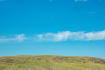 picturesque hill against the blue sky. Serenity