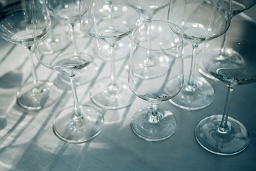 Many Empty wine glasses with sunlight