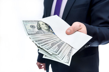 Businessman holding dollar banknotes and envelope in hands