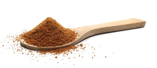 Coconut palm sugar with wooden spoon isolated on white background 