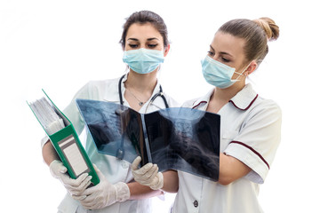 Doctors looking at patient's x-ray isolated on white