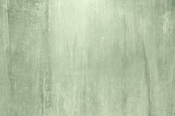 Old green grungy wall background or texture