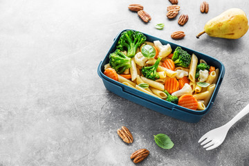 Healthy lunch to go served in box with vegetables