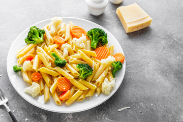 Healthy pasta penne with vegetables on plate