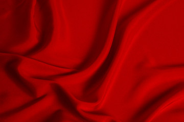 Naklejka na ściany i meble Red silk or satin luxury fabric texture can use as abstract background. Top view.