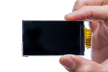 lcd screen digital display device electornic part disassembled on hand isolated on white