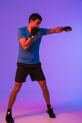 Portrait of a fit confident sportsman doing boxing