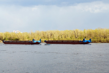 fishing boats on the river. transport barges on the river.