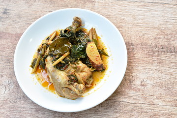 steamed spicy chicken thigh and leg with herb and chili on palte