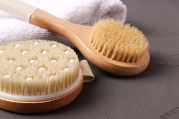 brush for dry massage on a colored background top view.