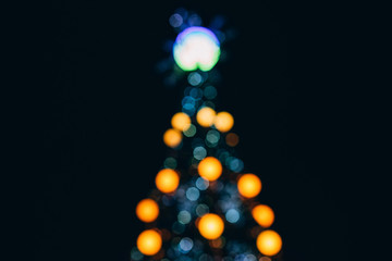 Christmas tree blurred. blurred background of Christmas lights. A new year tree decorated with...