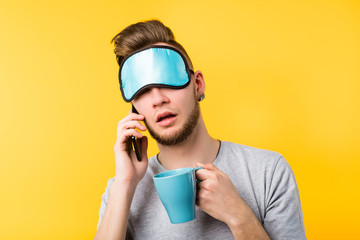 Remote job. Freelancer lifestyle and daily routine. Young guy beginning his morning with coffee and...