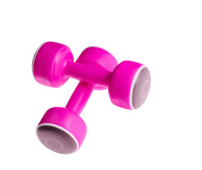 Two plastic pink dumbbells isolated on a white background. Sports concept.