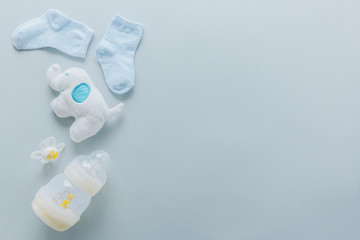 Baby goods on light blue background