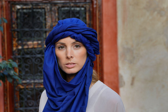 Portrait of woman wearing blue tuareg scarf