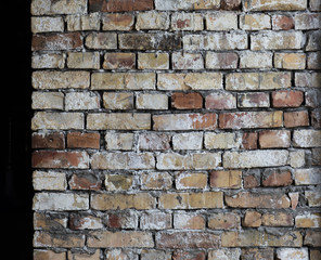 old weathered flaky brick wall