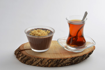Tea and chocolate pudding on wood board