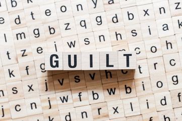 Guilt word concept on cubes