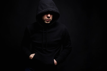 Fototapeta na wymiar Man in Hood. Boy in a hooded sweatshirt
