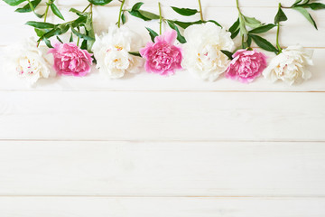 packaging template, layout of peonies on wooden white background