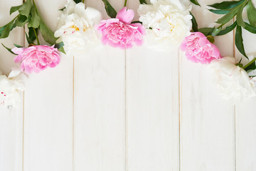 packaging template, layout of peonies on wooden white background