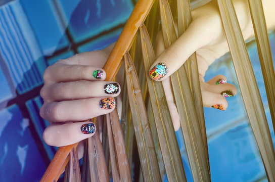 Female Hand With Color Nail Art Stickers