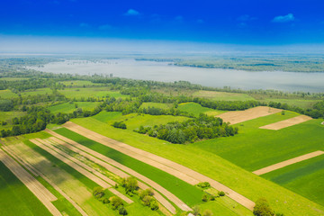 Beautiful countryside landscape in nature park Lonjsko polje, Croatia, from air, panoramic view, agriculture fields and flooded field in spring