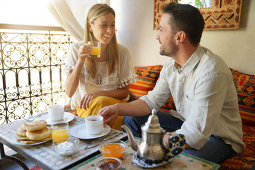 Couple having breakfast in a Riad hotel in Marrakech