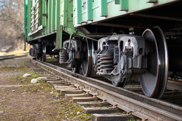 Dual gauge track example that allows the passage of trains of two different track gauges narrow-gauge railway and broad-gauge railway with freight wagons on it