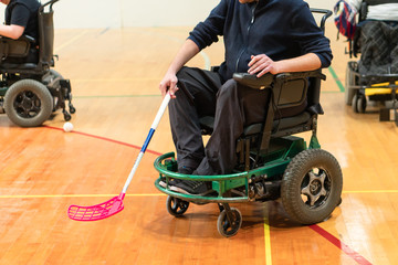 Disabled People on an electric wheelchair playing sports, powerchair hockey. IWAS - International wheelchair and amputee sports federation