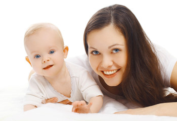 Portrait close-up happy smiling mother and baby lying isolated on white background