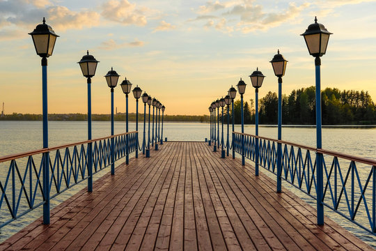 image of the bridge over the lake Valdai at sunset