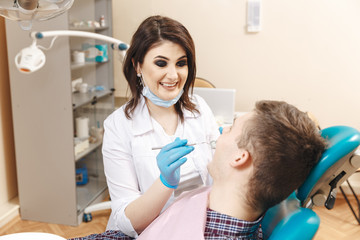 Doctor with patient in the dentist cabinet