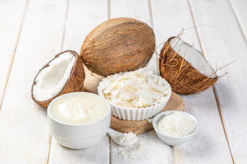 Wellness concept - coconut oil and ingredients on wood background, copy space