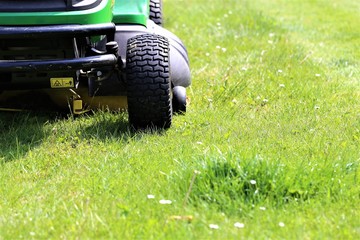 lawn mower on green grass