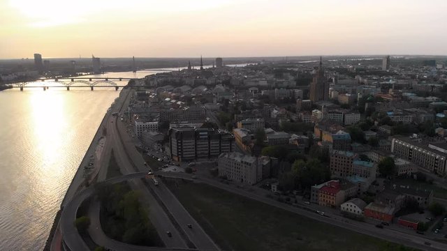 Aerial sunset shots of European capital city Riga, Latvia in Spring 2019 - River Daugava and bridges are seen in the background