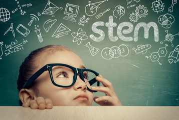 STEM word and doodles above beautiful cute little girl. modern education concept