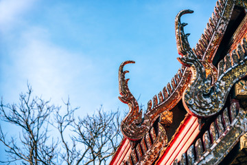 Fototapeta na wymiar Architecture Art at a Thai Temple Rooftop