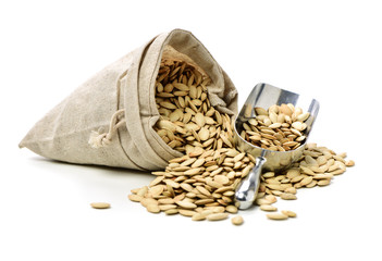 Pumpkin seeds on white background 
