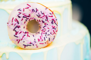 Glazed round donut with powder. blue and lilac donut.