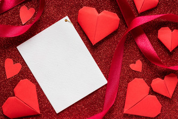 White blank paper on red glitter texture, valentines day and romance concept, wedding anniversary gift