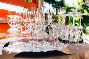 glass for wine. many empty glasses on a picnic in nature