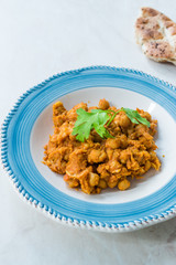 Chole or Chana Masala or Spicy Chickpeas is traditional North Indian main course recipe and usually served with Bhature or Roti/ Naan.